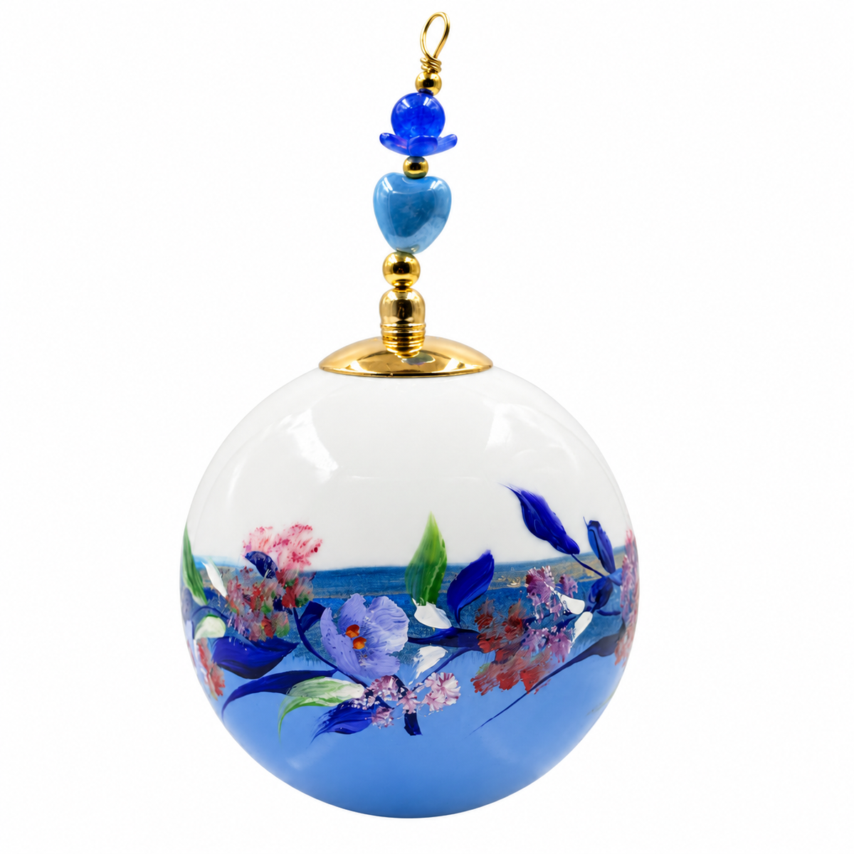 Boule de Noël artisanale personnalisable 6,5 cm, référence 21, vue 2 — Fleurs bleues et roses sur bleu lavande